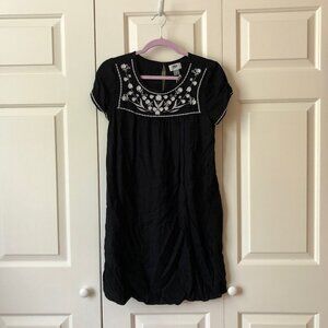 Black swing dress with white floral embroidery